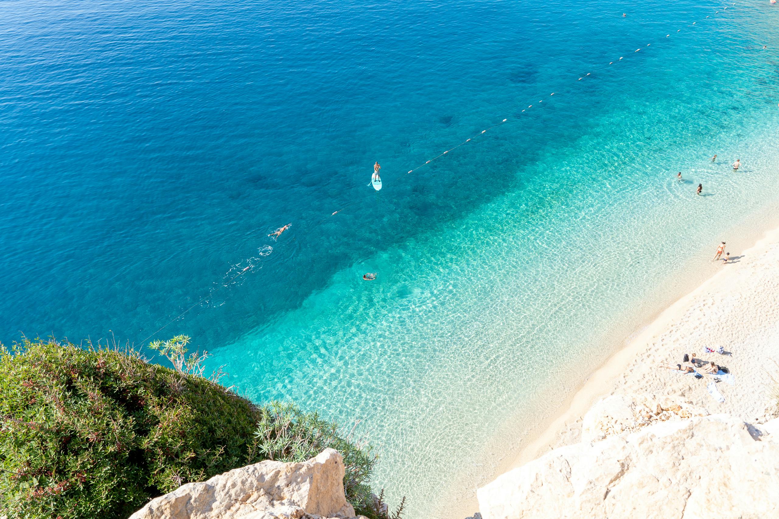 A stunning aerial view of Kaputas Beach in Antalya, Turkey, with clear turquoise waters and sandy shores.