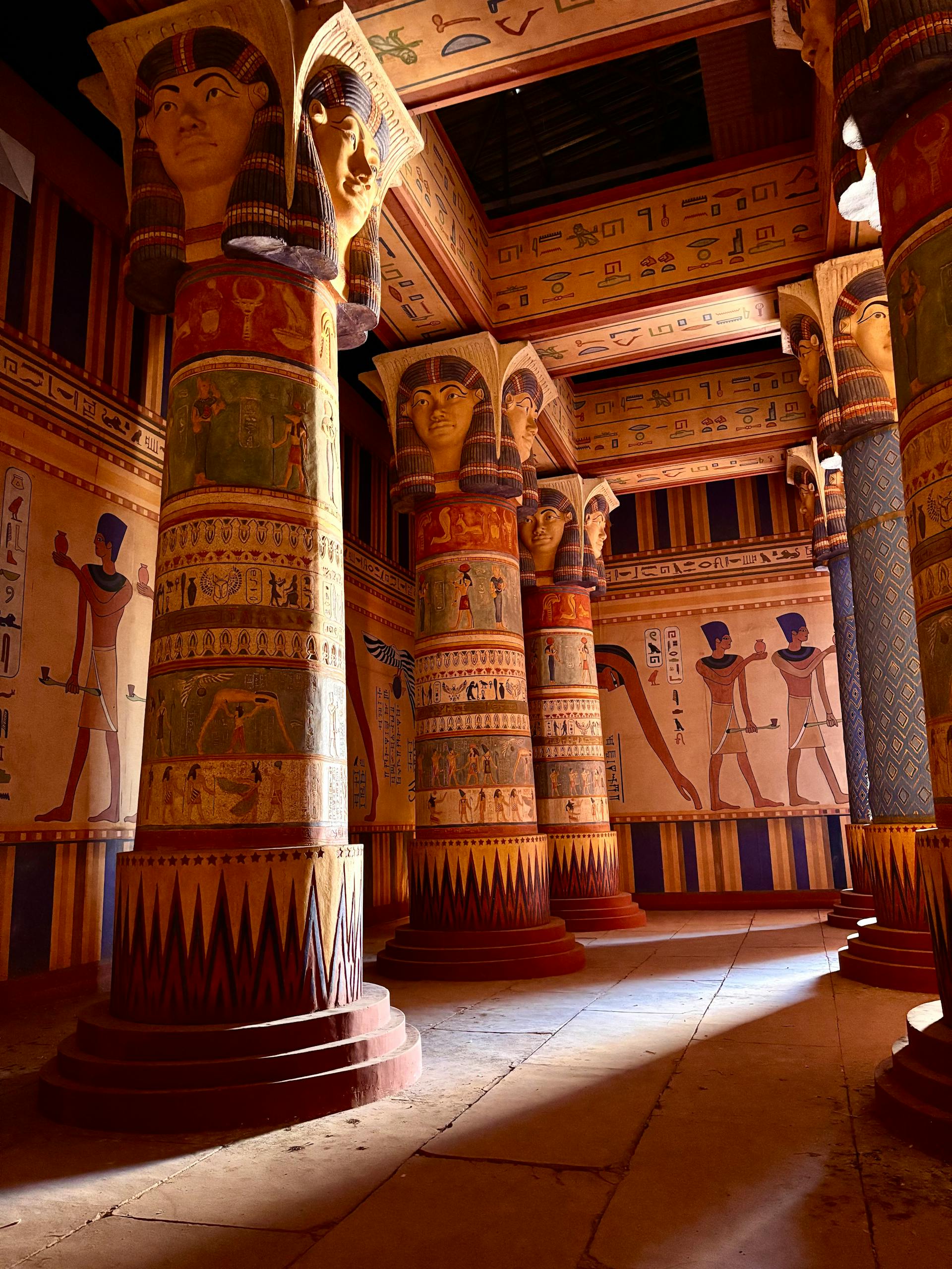 Captivating view of a historic Egyptian temple interior showcasing hieroglyphics and vivid artwork.