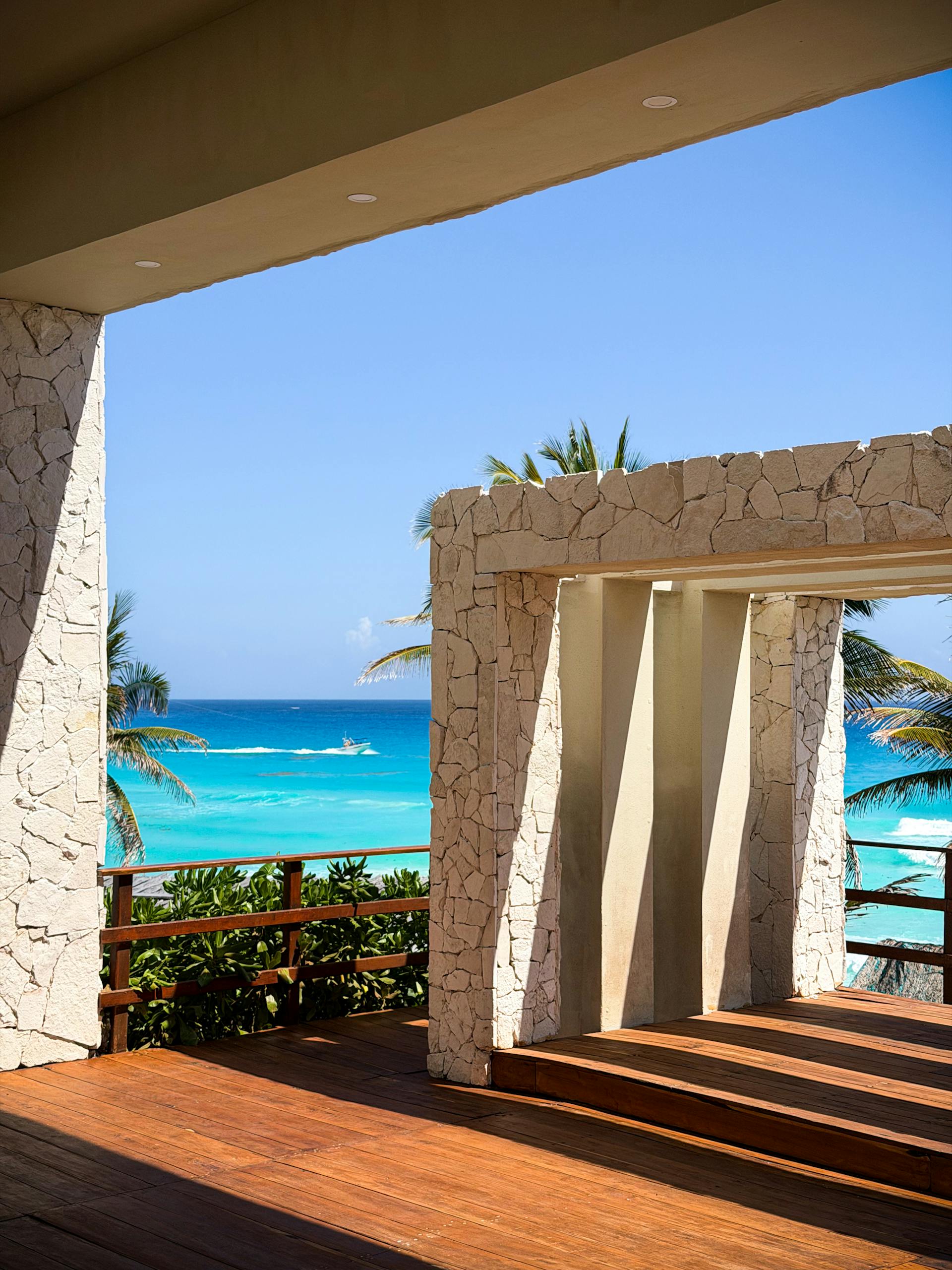 Elegant stone terrace overlooking the turquoise waters of Cancún, México.