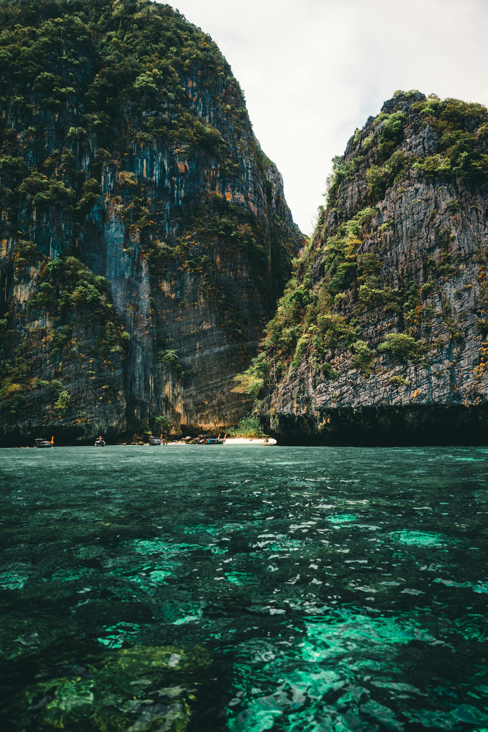 Explore the breathtaking limestone cliffs and turquoise waters of Phuket, Thailand.
