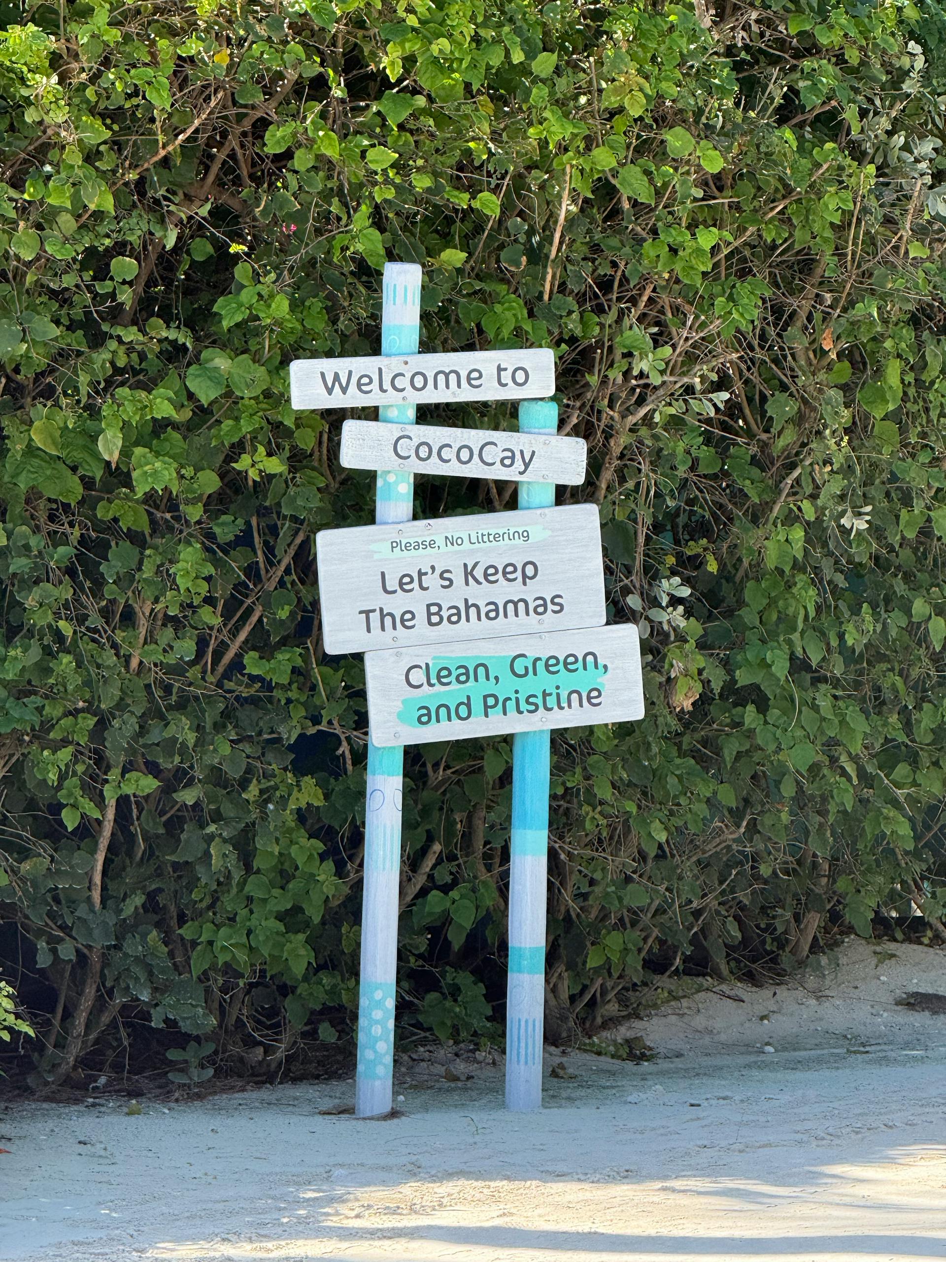 Sign welcoming visitors to CocoCay, promoting cleanliness in the Bahamas.