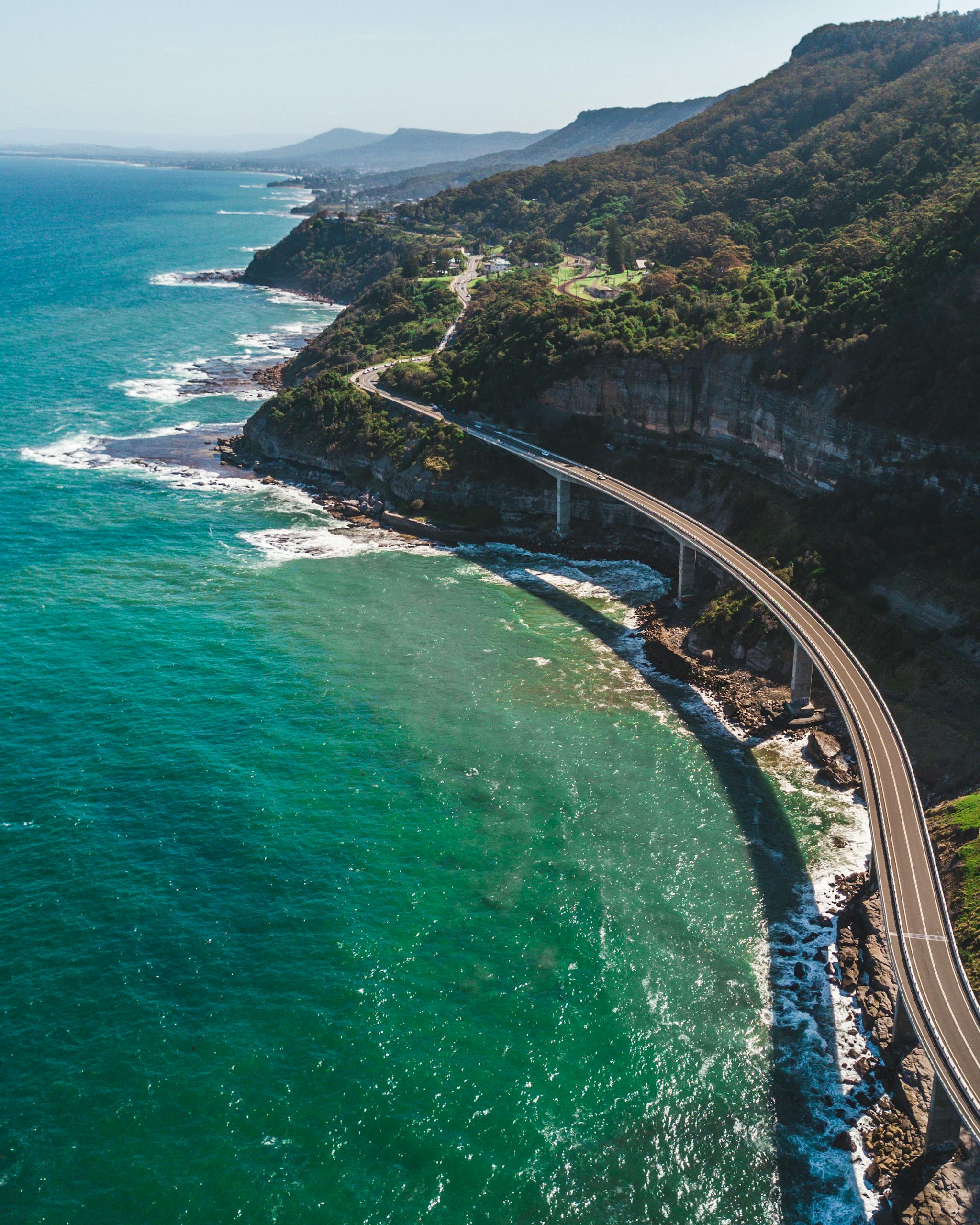 Breathtaking aerial view of Sea Cliff Bridge with stunning coastal landscape in New South Wales, Australia.