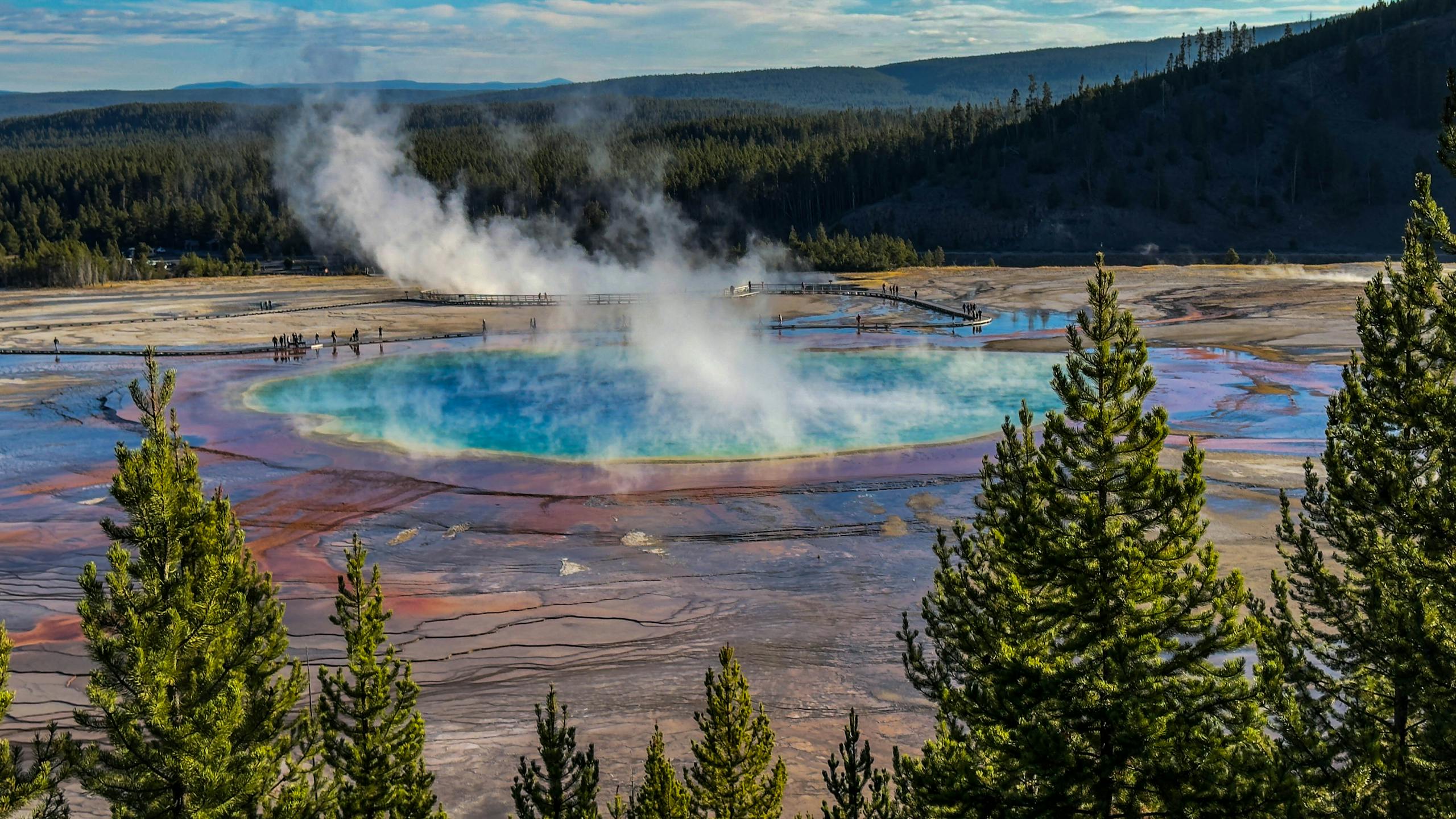 Captivating view of Grand Prismatic Spring in Yellowstone, showcasing vibrant colors and natural beauty.