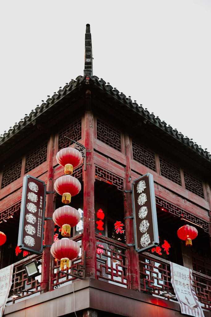 Explore the elegance of traditional Chinese architecture with red lanterns in Nanjing's urban setting.