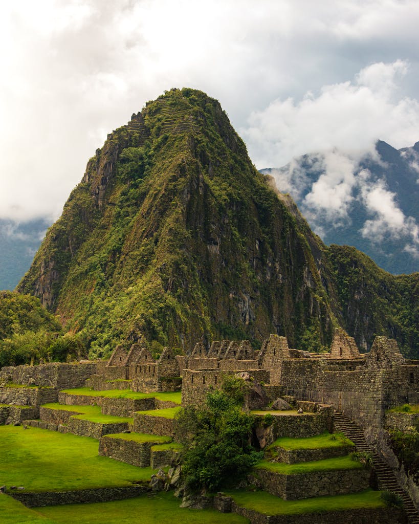 Explore the majestic ruins of Machu Picchu with its stunning mountainous backdrop in Peru.
