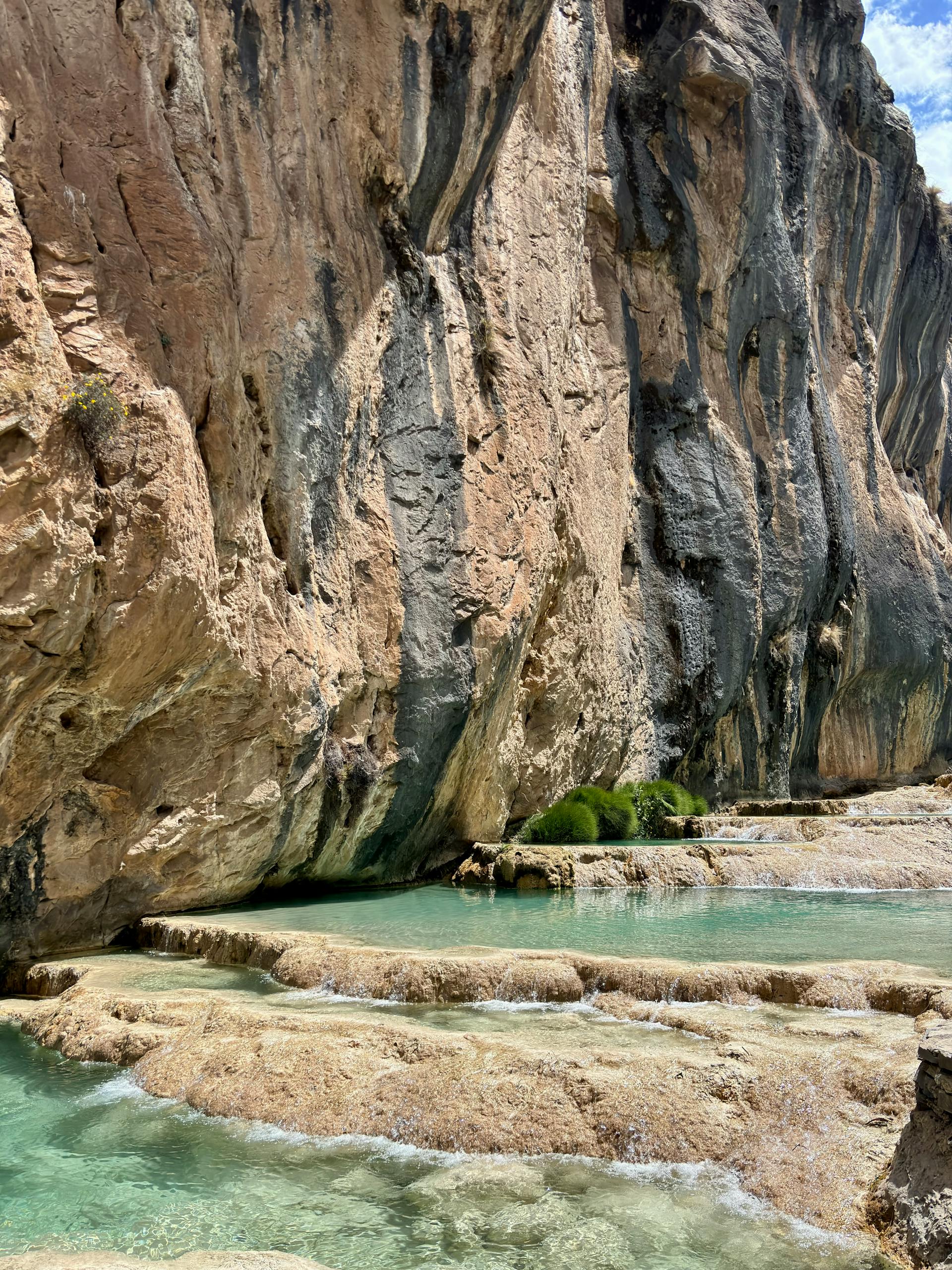 Stunning natural rock formation with turquoise water in Ayacucho, Peru, showcasing unique geological beauty.